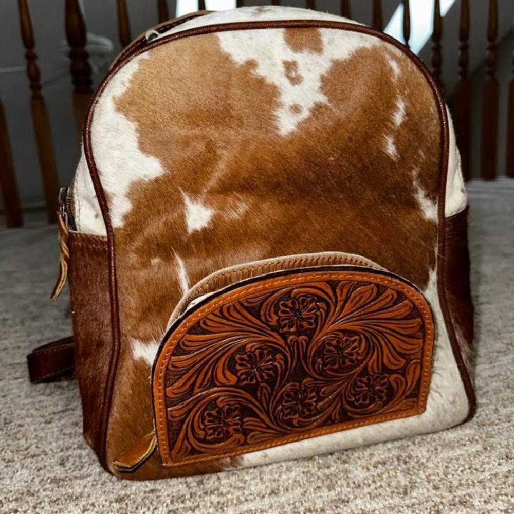 Brown and White Cowhide Backpack with Floral Design